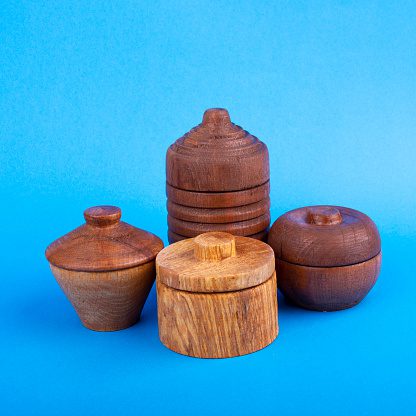 Wooden containers on blue background