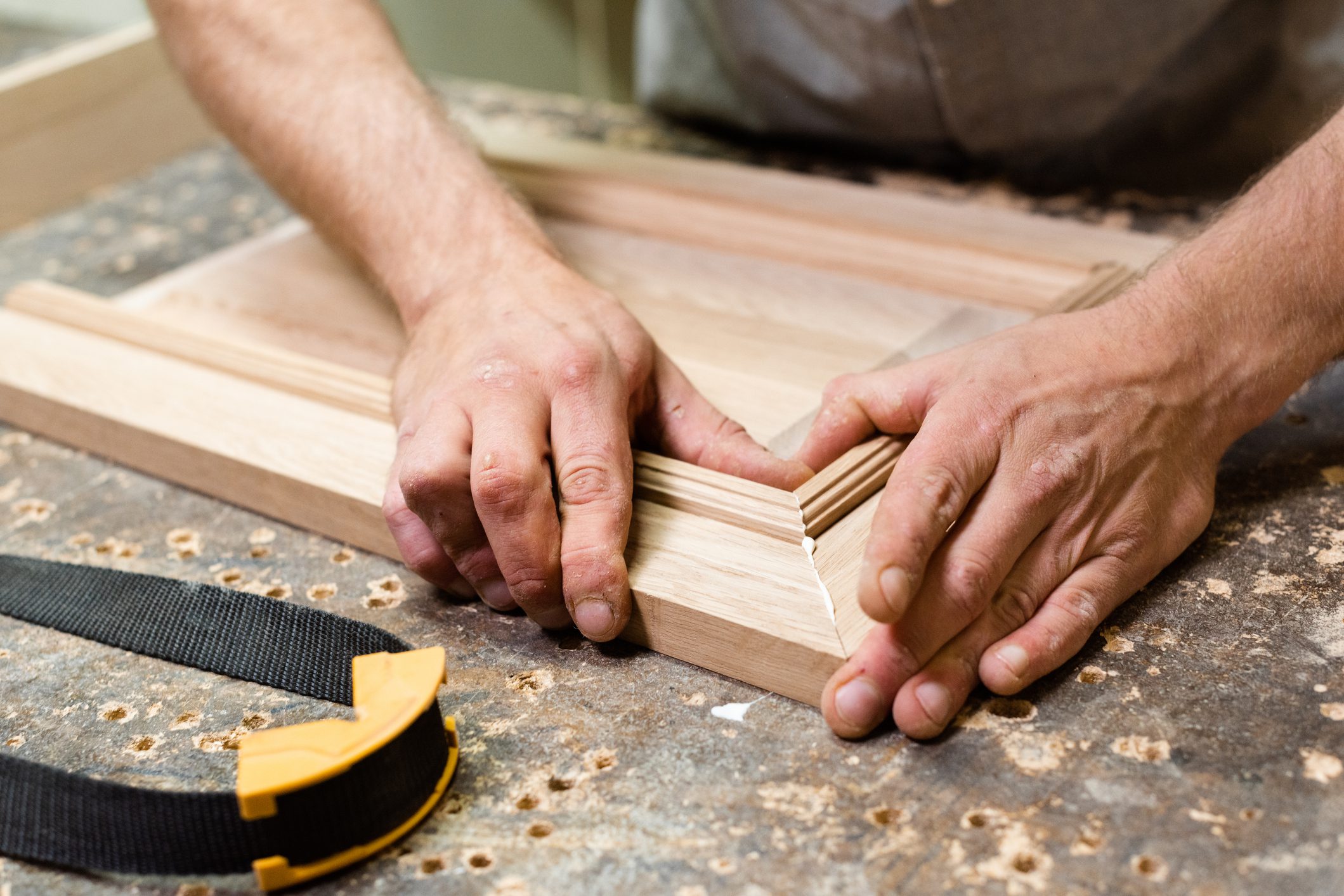 Woodworking in progress with clamp nearby