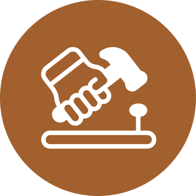 Hammer and nail symbol, brown background.